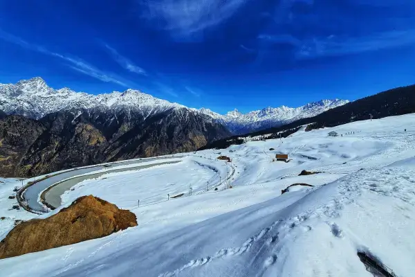 Snow-covered slopes of Auli, perfect for an adventure Uttarakhand tour.
