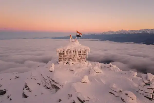 Tungnath temple in Chopta with clouds, a Beuiful place to visit during chardham yatra package.