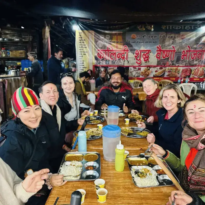 Clients enjoying a traditional meal and temple visits with Our professional Guide Sunny Dhiman on our Chardham tour package.