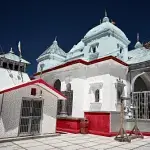 The white marble Gangotri Temple in Uttarakhand, a key destination in our all-inclusive Chardham package.
