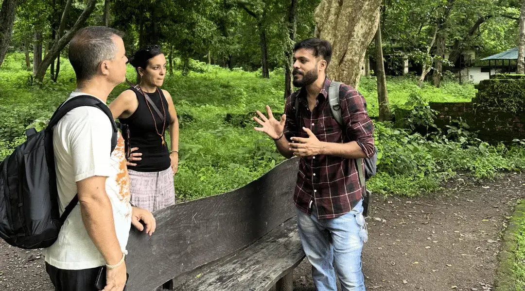 Foreign tourists interacting with our local expert Sunny about Char Dham Yatra history and spiritual significance.